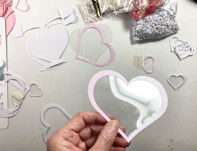 I glued the large acetate heart to the large pink glitter cardstock hear